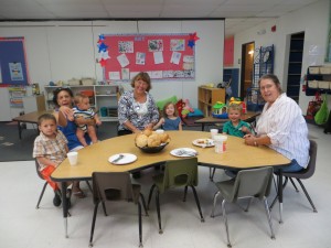 kids and grandparents having tea